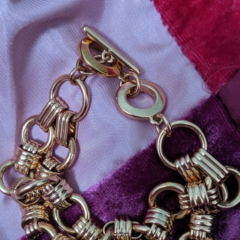 Gold double strand large chain gold bracelet.